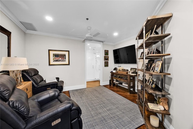 living room featuring wood finished floors, crown molding, baseboards, a ceiling fan, and recessed lighting