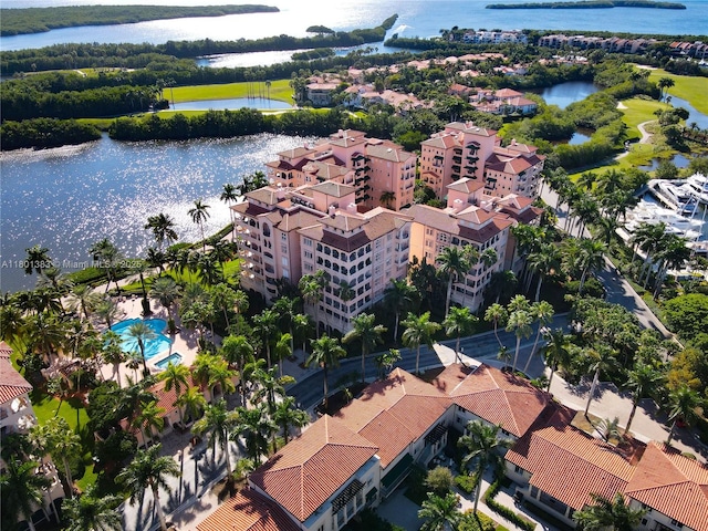 bird's eye view of a nearby body of water and apartment complex / building