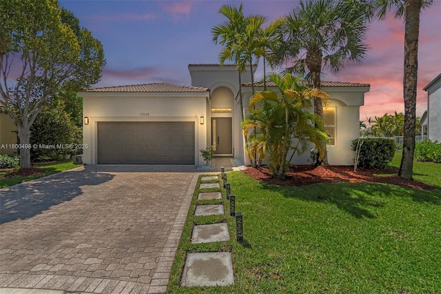 17028 SW 52nd Ct, Miramar, FL 33027 - mediterranean / spanish-style house with a tile roof, decorative driveway, and stucco siding