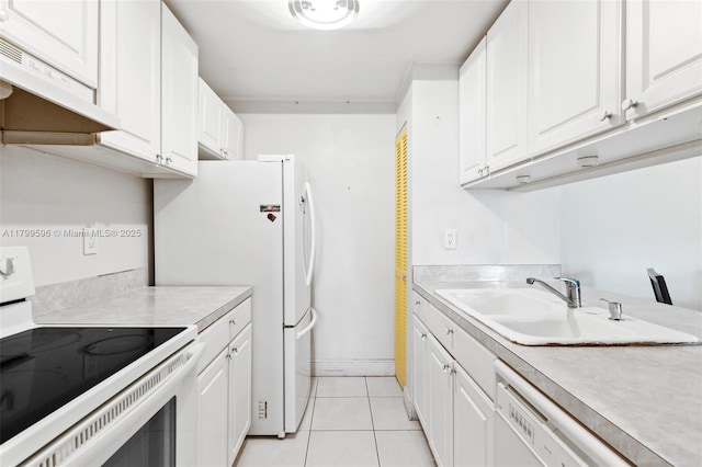 kitchen with white appliances, a sink, under cabinet range hood, and light countertops