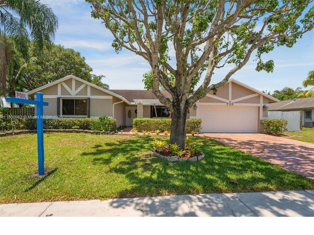 735 SW 158th Ter, Sunrise, FL 33326 - single story home featuring stucco siding, decorative driveway, a garage, and a front lawn