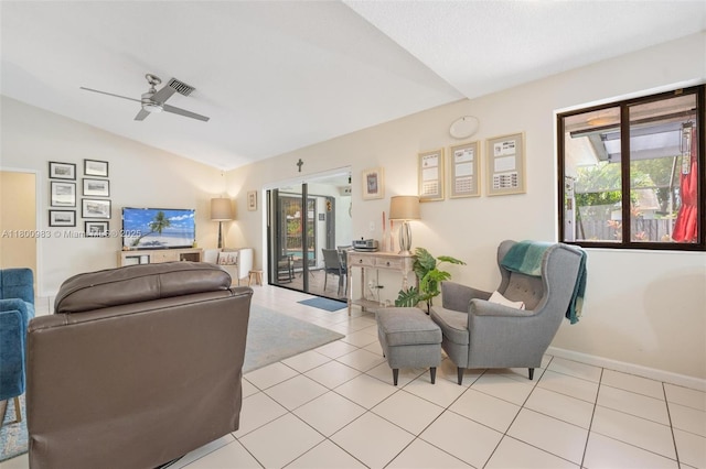 735 SW 158th Ter, Sunrise, FL 33326 - living area featuring vaulted ceiling, ceiling fan, light tile patterned floors, and baseboards