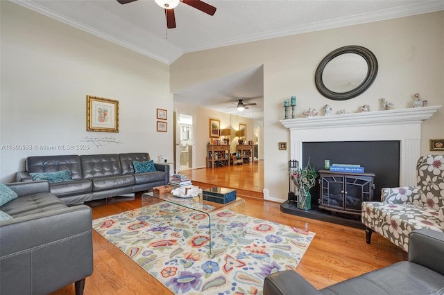 735 SW 158th Ter, Sunrise, FL 33326 - living room featuring ceiling fan, ornamental molding, wood finished floors, and a fireplace