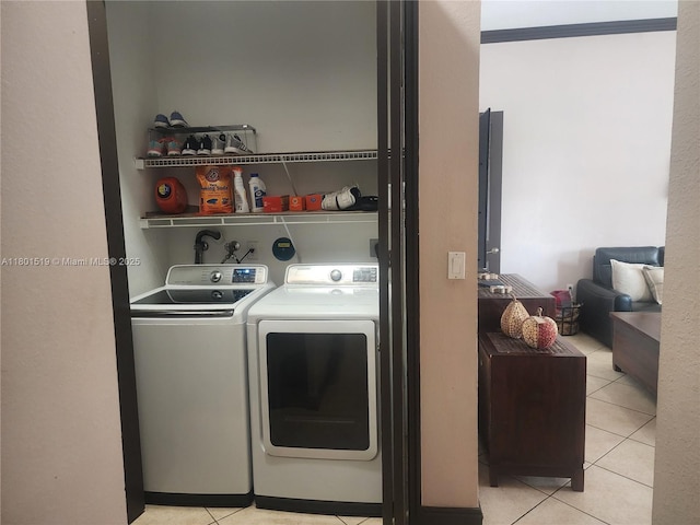 8216 SW 166th Pl, Miami, FL 33193 - laundry room featuring washer and clothes dryer and light tile patterned flooring