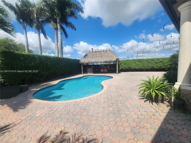 8216 SW 166th Pl, Miami, FL 33193 - view of pool featuring a gazebo, a patio area, and a fenced backyard
