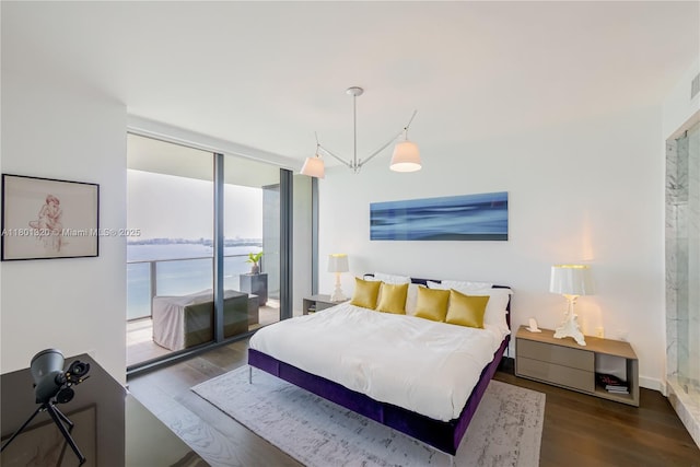 3131 NE 7th Ave Unit 3606, Miami, FL 33137 - bedroom with access to exterior, wood finished floors, and expansive windows