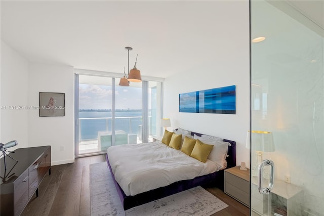 3131 NE 7th Ave Unit 3606, Miami, FL 33137 - bedroom with access to exterior, dark wood-type flooring, floor to ceiling windows, a water view, and baseboards
