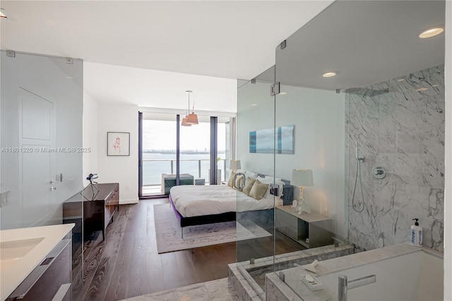 3131 NE 7th Ave Unit 3606, Miami, FL 33137 - bedroom with dark wood finished floors, a wall of windows, recessed lighting, and access to outside