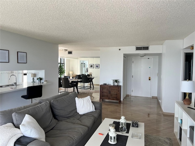 4000 NE Towwerside Ter Unit 1101, Miami, FL 33138 - living area featuring a textured ceiling