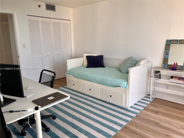 4000 NE Towwerside Ter Unit 1101, Miami, FL 33138 - bedroom with wood finished floors, a closet, and an office area