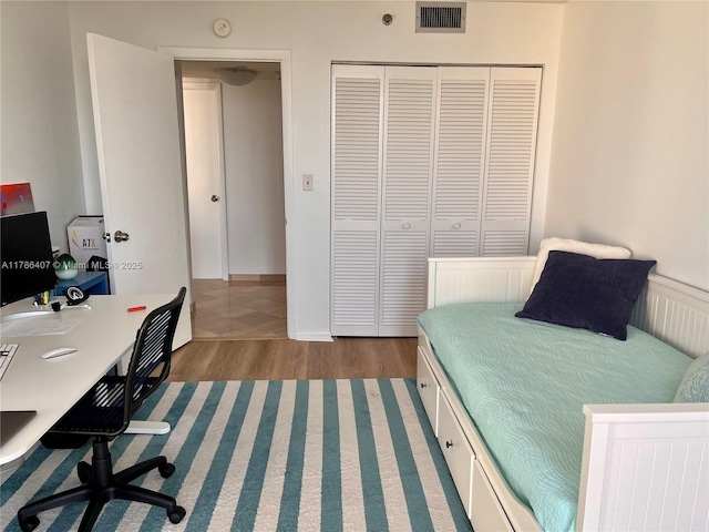 4000 NE Towwerside Ter Unit 1101, Miami, FL 33138 - bedroom with wood finished floors, a closet, and an office area