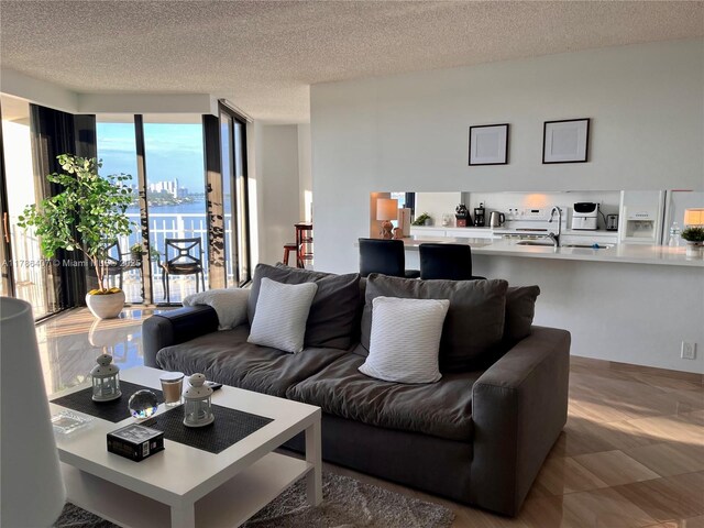 4000 NE Towwerside Ter Unit 1101, Miami, FL 33138 - living area with a textured ceiling and expansive windows