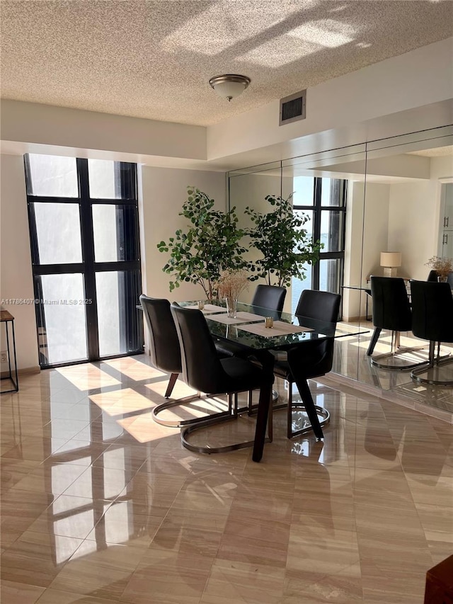 4000 NE Towwerside Ter Unit 1101, Miami, FL 33138 - dining room with a textured ceiling and french doors