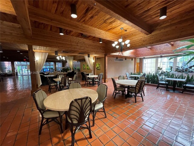 4000 NE Towwerside Ter Unit 1101, Miami, FL 33138 - tiled dining area featuring beamed ceiling, wooden ceiling, healthy amount of natural light, and a chandelier
