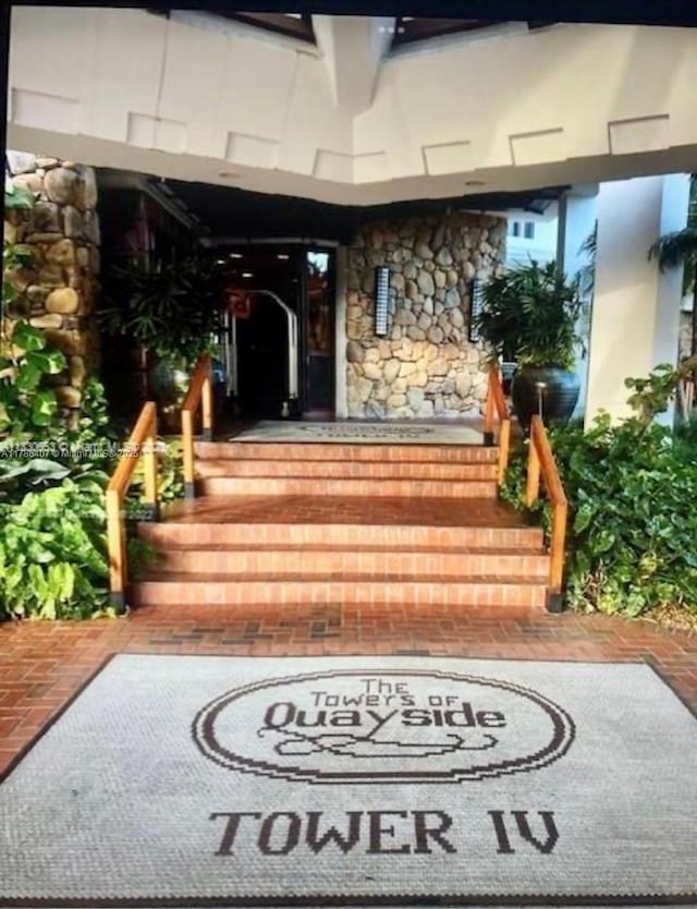 4000 NE Towwerside Ter Unit 1101, Miami, FL 33138 - doorway to property featuring stone siding and stucco siding
