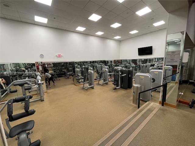 4000 NE Towwerside Ter Unit 1101, Miami, FL 33138 - exercise room featuring a paneled ceiling and a high ceiling