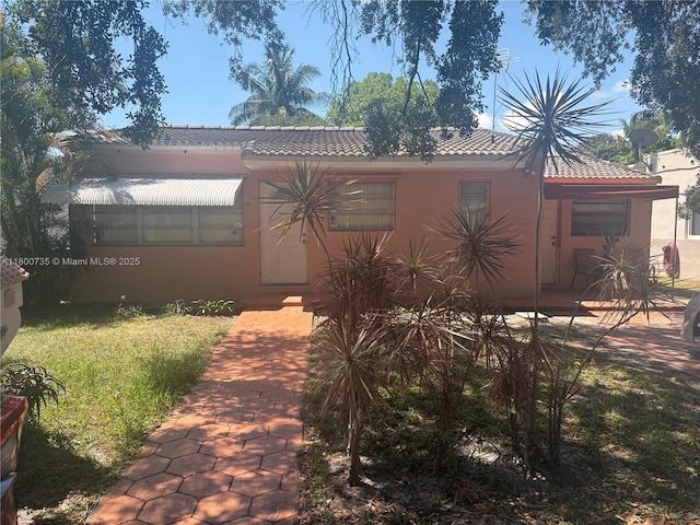 2530 Washington St, Hollywood, FL 33020 - view of front of property with a tile roof and stucco siding