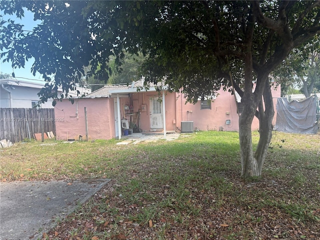 2530 Washington St, Hollywood, FL 33020 - back of property with stucco siding and central AC unit