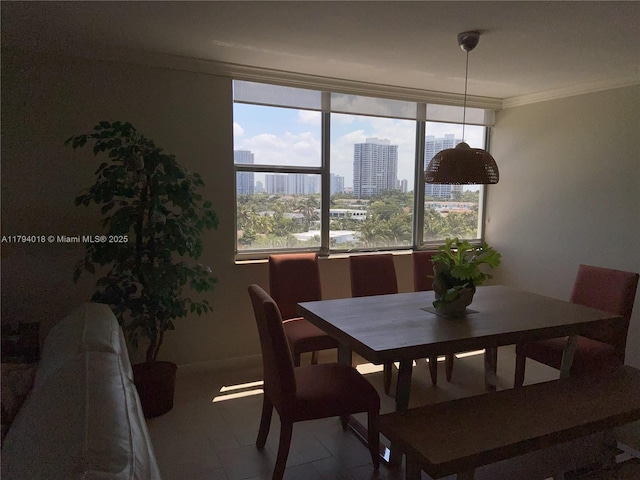 3180 S Ocean Dr Unit 716, Hallandale Beach, FL 33009 - dining room featuring a city view, crown molding, and baseboards