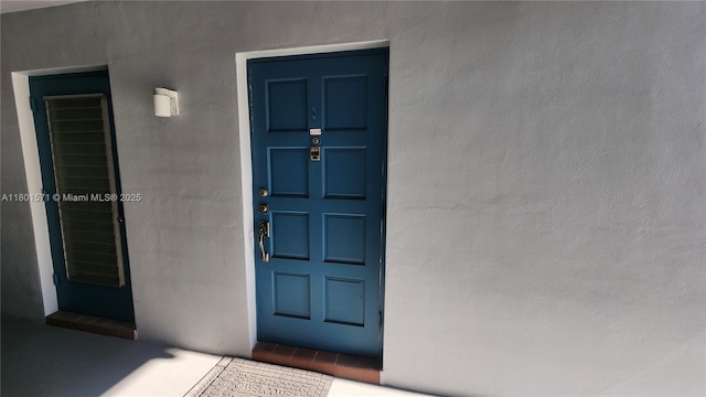 981 Hillcrest Ct Unit 114, Hollywood, FL 33021 - doorway to property with stucco siding