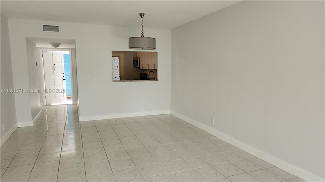981 Hillcrest Ct Unit 114, Hollywood, FL 33021 - unfurnished dining area with light tile patterned floors, baseboards, and a sink