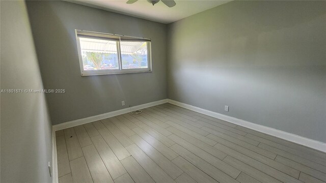 981 Hillcrest Ct Unit 114, Hollywood, FL 33021 - empty room with baseboards, wood finished floors, and a ceiling fan