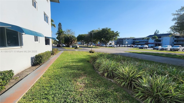 981 Hillcrest Ct Unit 114, Hollywood, FL 33021 - view of grassy yard featuring a residential view