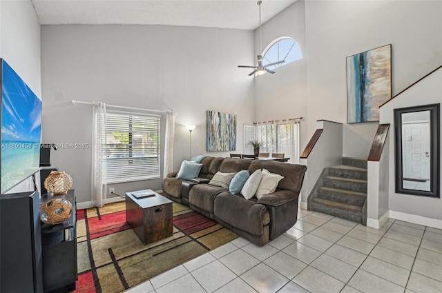 2323 NW 37th Ave, Coconut Creek, FL 33066 - tiled living room with a high ceiling, healthy amount of natural light, stairs, and ceiling fan