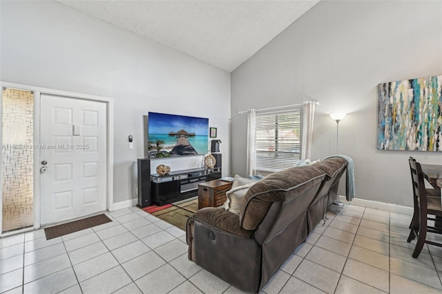 2323 NW 37th Ave, Coconut Creek, FL 33066 - living room featuring high vaulted ceiling and light tile patterned floors