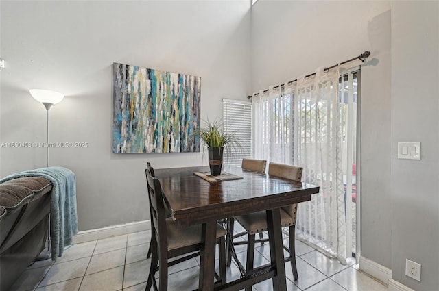 2323 NW 37th Ave, Coconut Creek, FL 33066 - dining space with light tile patterned floors and a towering ceiling