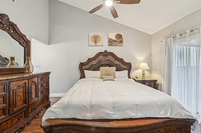 2323 NW 37th Ave, Coconut Creek, FL 33066 - bedroom featuring vaulted ceiling, dark wood-style floors, ceiling fan, and a textured ceiling