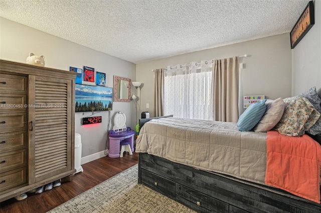 2323 NW 37th Ave, Coconut Creek, FL 33066 - bedroom featuring dark wood finished floors and a textured ceiling