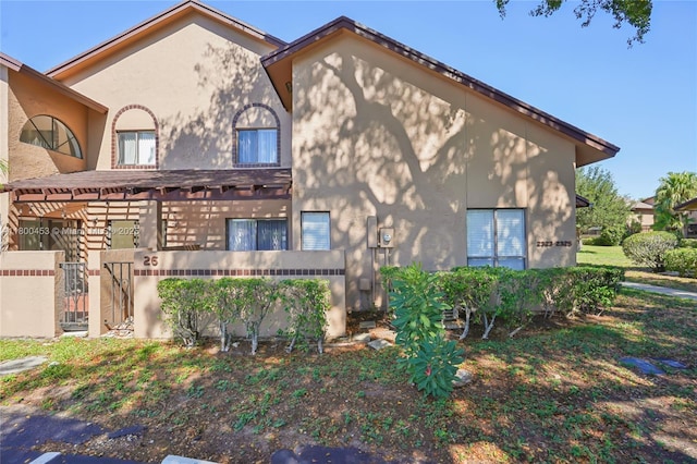 2323 NW 37th Ave, Coconut Creek, FL 33066 - view of home's exterior featuring stucco siding and a gate