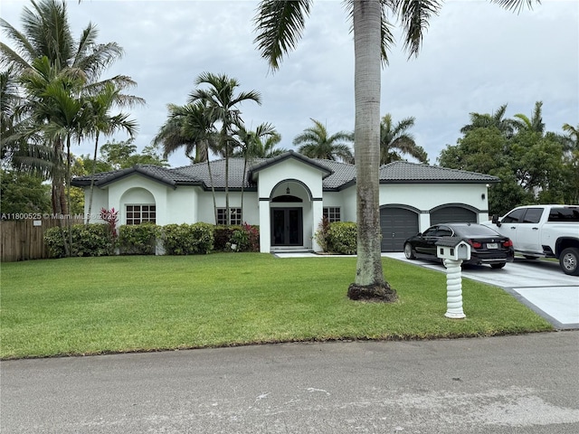 13135 SW 218th Ter, Miami, FL 33170 - ranch-style house featuring a garage, stucco siding, concrete driveway, and a tiled roof