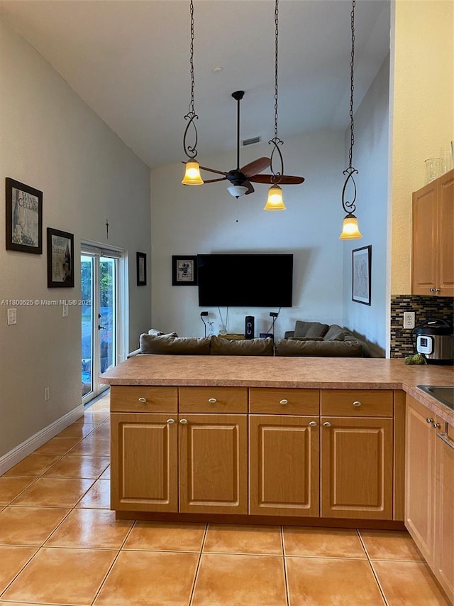13135 SW 218th Ter, Miami, FL 33170 - kitchen with high vaulted ceiling, open floor plan, ceiling fan, light tile patterned floors, and baseboards
