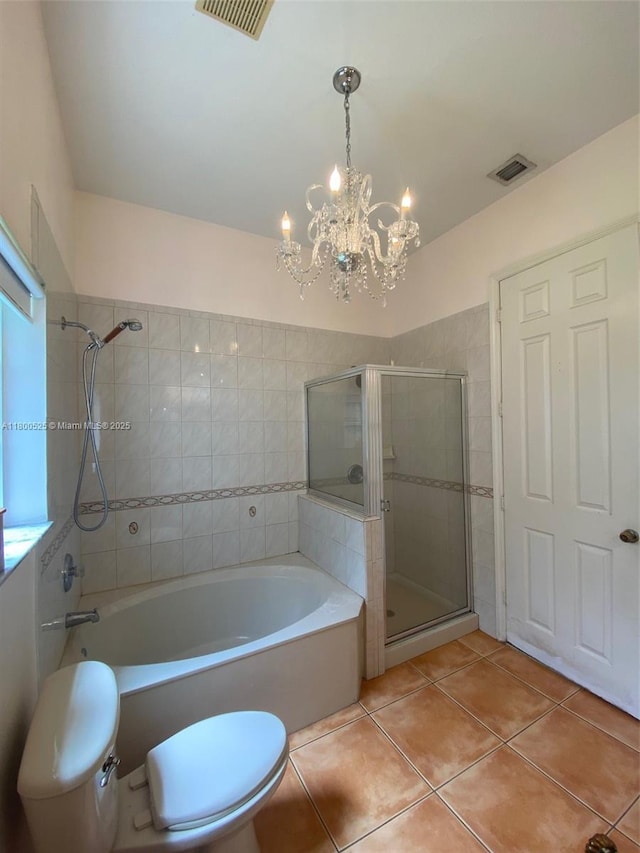13135 SW 218th Ter, Miami, FL 33170 - full bath with tile patterned floors, a shower stall, a bath, and a chandelier