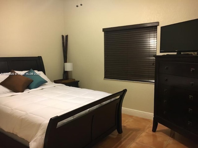 13135 SW 218th Ter, Miami, FL 33170 - bedroom with light tile patterned floors and baseboards