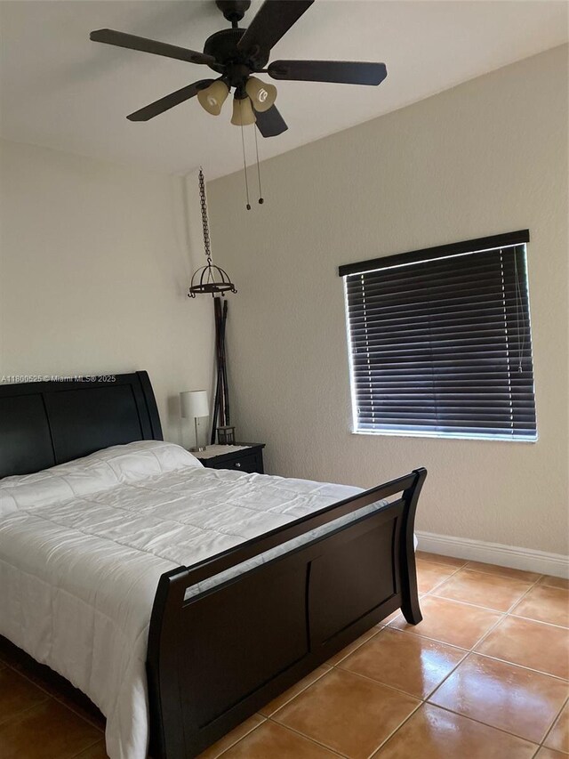 13135 SW 218th Ter, Miami, FL 33170 - tiled bedroom with ceiling fan and baseboards