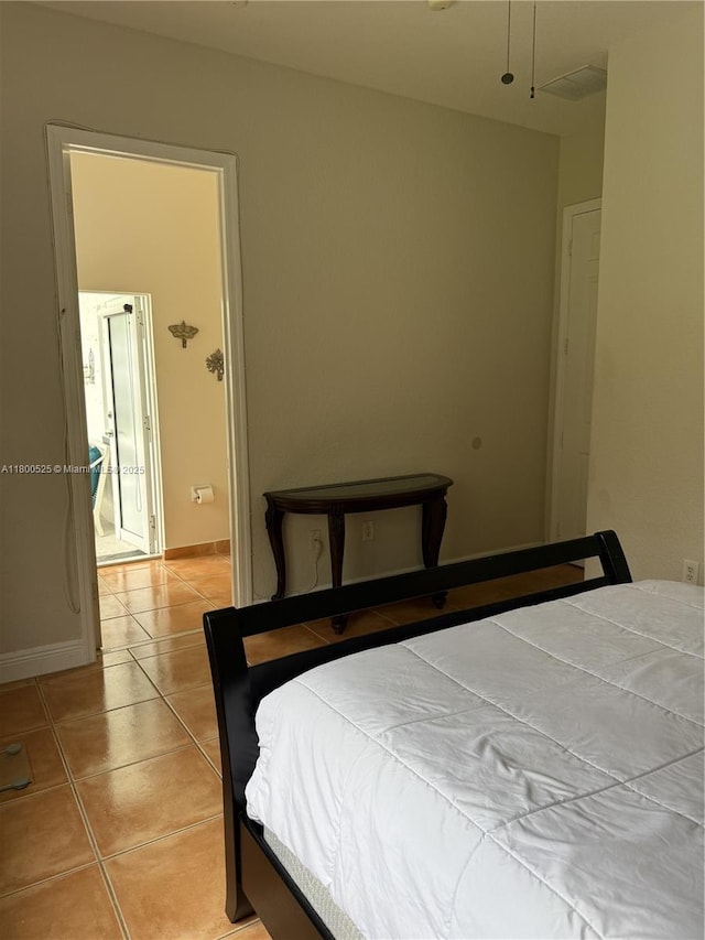 13135 SW 218th Ter, Miami, FL 33170 - bedroom with light tile patterned floors and baseboards