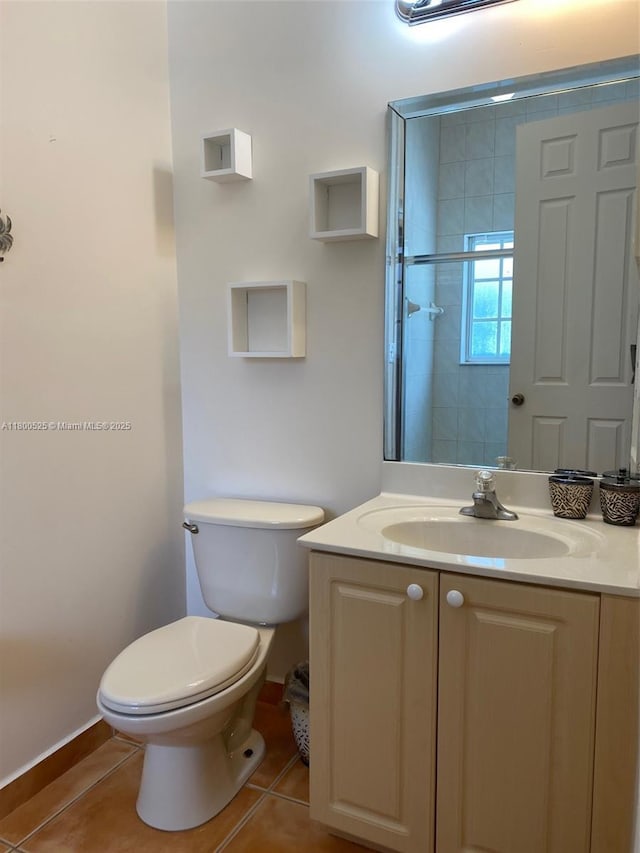 13135 SW 218th Ter, Miami, FL 33170 - bathroom with tile patterned floors, toilet, vanity, and baseboards