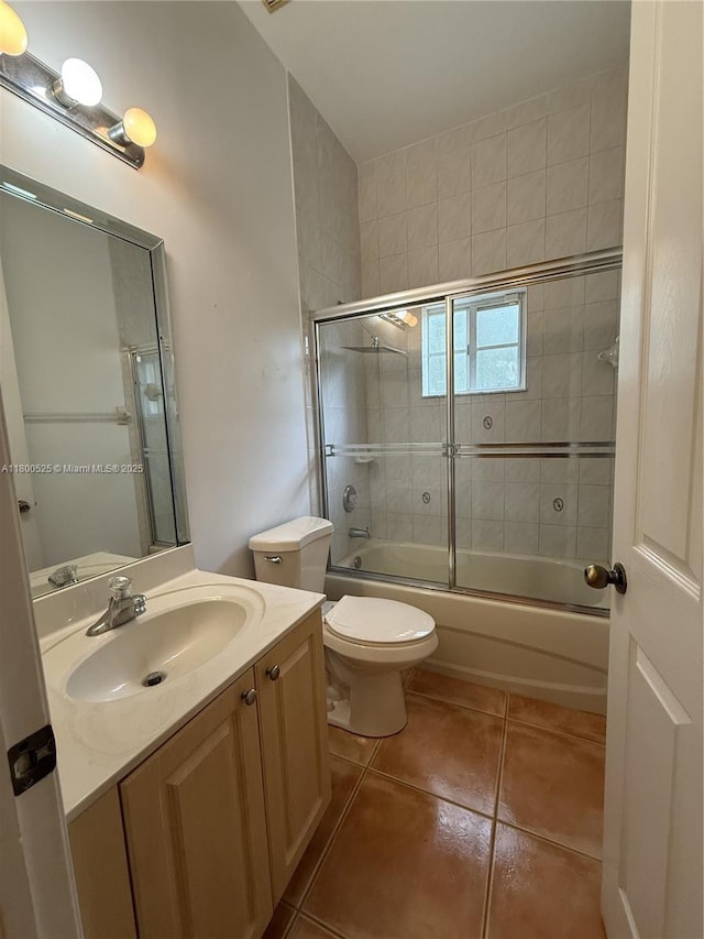 13135 SW 218th Ter, Miami, FL 33170 - full bathroom with tile patterned flooring, vanity, bath / shower combo with glass door, and toilet