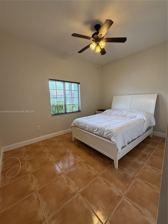 13135 SW 218th Ter, Miami, FL 33170 - bedroom with tile patterned floors, baseboards, and a ceiling fan