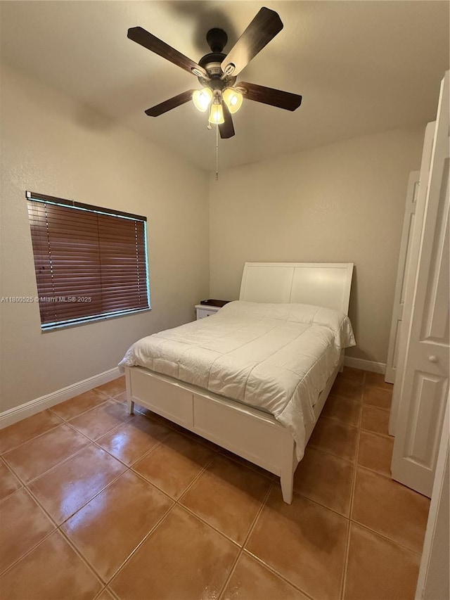 13135 SW 218th Ter, Miami, FL 33170 - tiled bedroom featuring a ceiling fan and baseboards