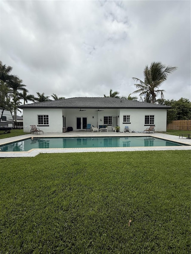 13135 SW 218th Ter, Miami, FL 33170 - rear view of house with an outdoor pool and a patio area