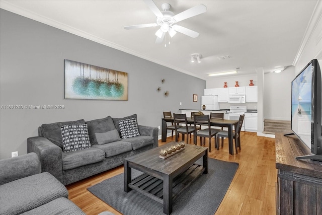 2950 Lucayan Harbour Cir Unit 107, Kissimmee, FL 34746 - living area with ornamental molding, ceiling fan, and light wood-style floors