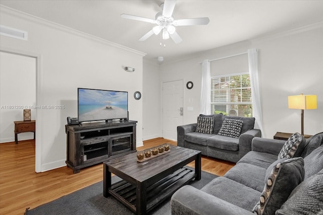 2950 Lucayan Harbour Cir Unit 107, Kissimmee, FL 34746 - living room featuring ceiling fan, crown molding, wood finished floors, and baseboards
