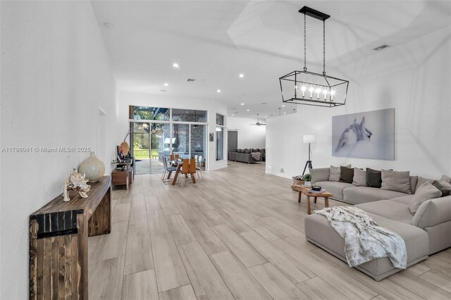 2623 Oakbrook Dr, Weston, FL 33332 - living room with a chandelier, recessed lighting, and light wood-type flooring