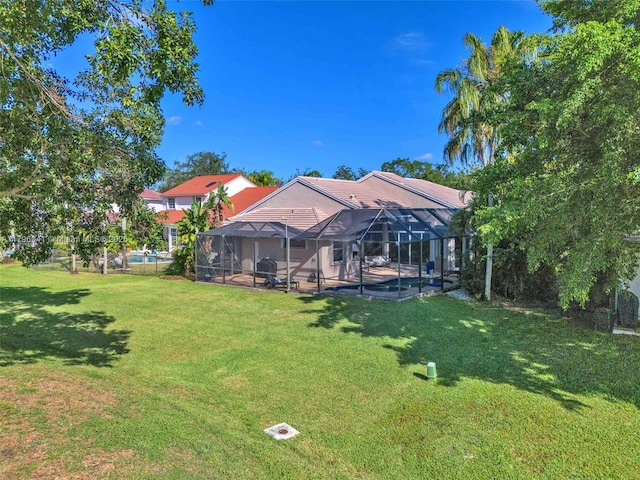 2623 Oakbrook Dr, Weston, FL 33332 - view of grassy yard featuring an outdoor pool, a lanai, and a patio