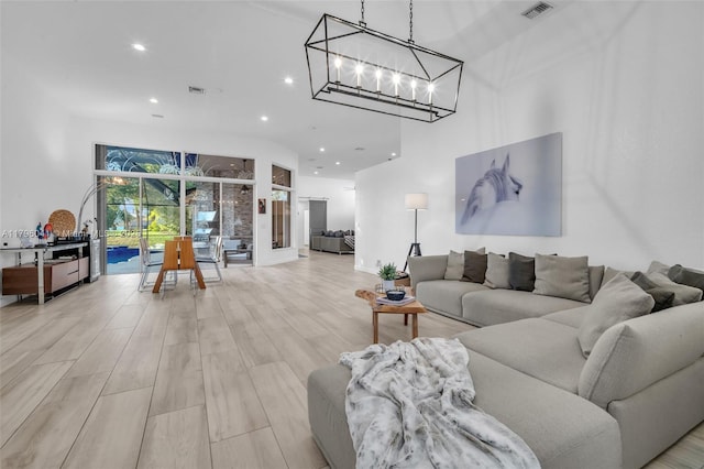 2623 Oakbrook Dr, Weston, FL 33332 - living room with recessed lighting, wood finished floors, and a chandelier