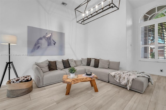2623 Oakbrook Dr, Weston, FL 33332 - living area featuring wood finished floors and a chandelier